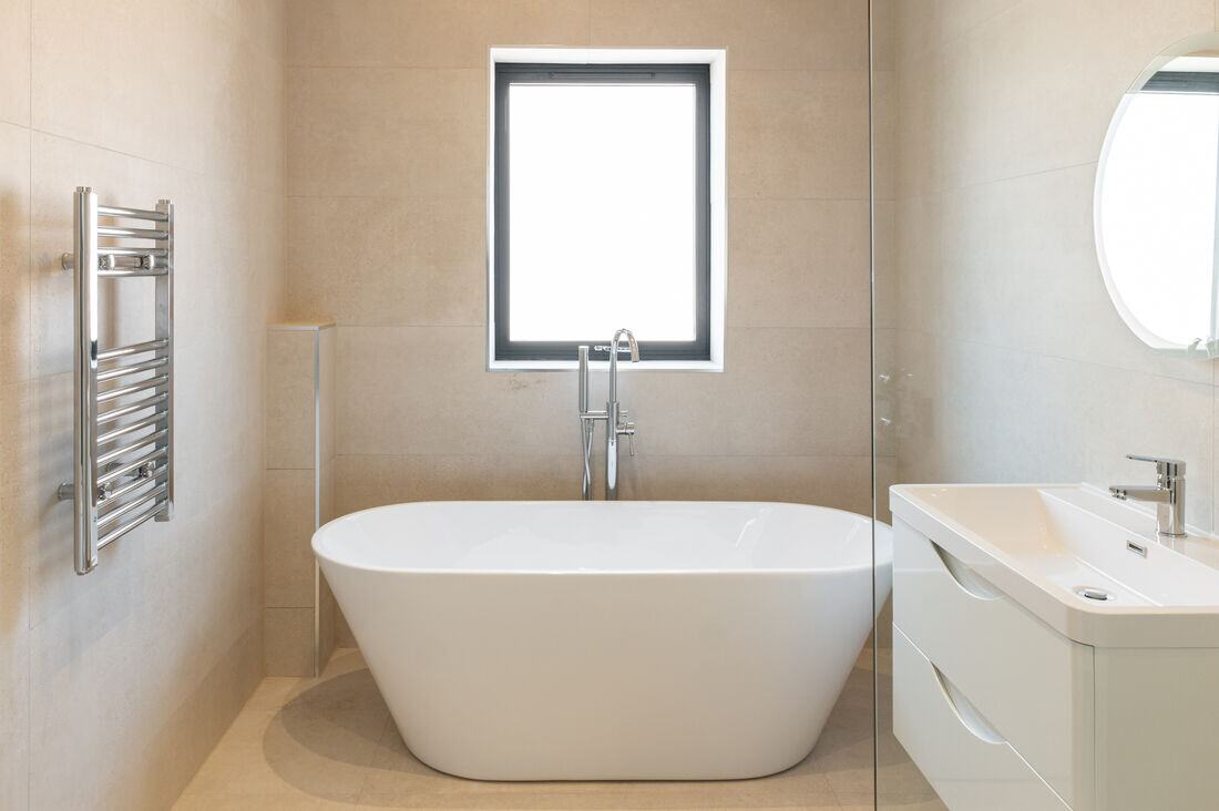 A tiled bathroom in a managed property.