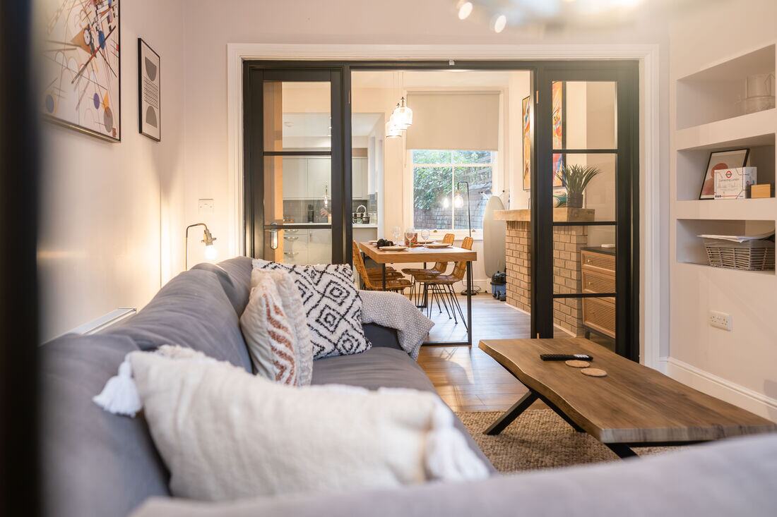 A sitting room with Crittall-style doors in a property managed by Torr Property Group.